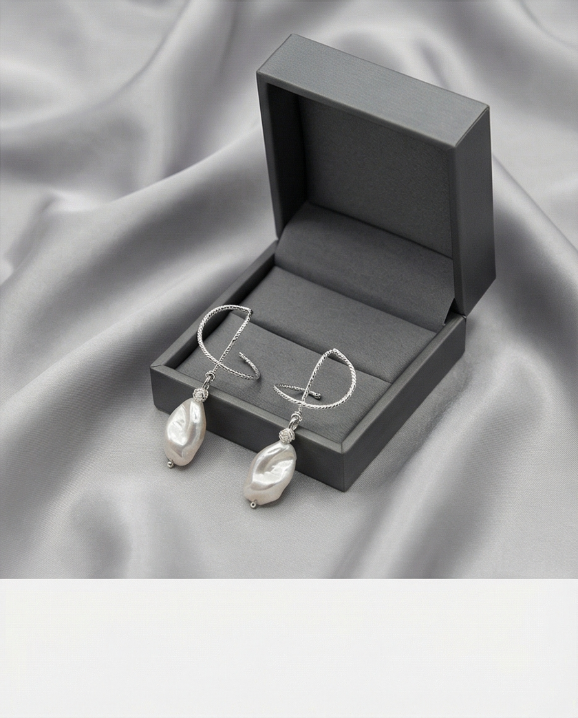 Silver omega earrings with an artificial brook pearl