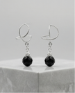 White gold omega earrings with onyx stone