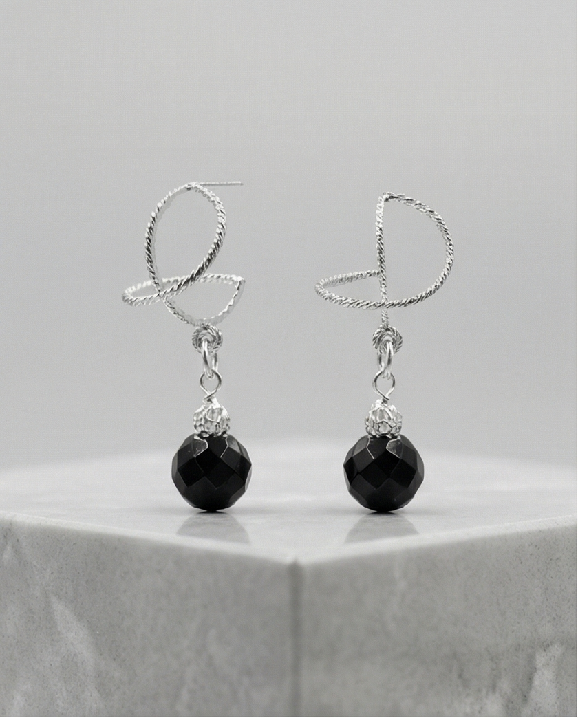 White gold omega earrings with onyx stone
