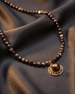 Pearl necklace in chocolate tones with pendant