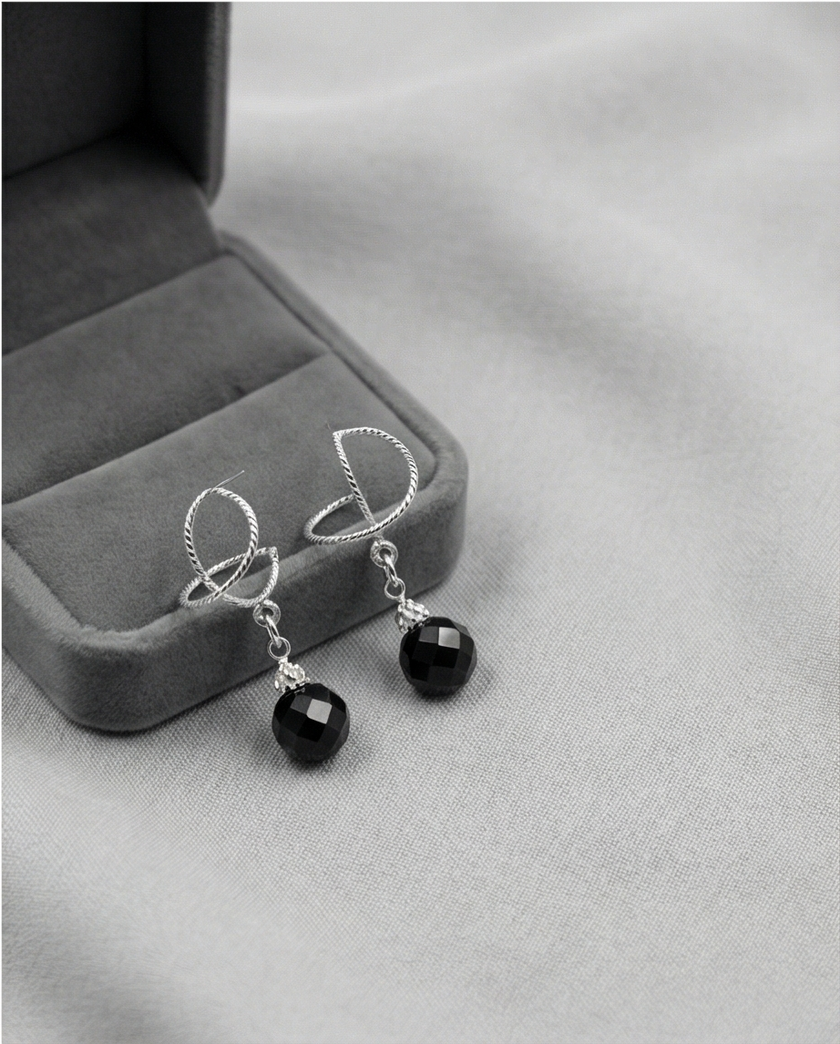 White gold omega earrings with onyx stone