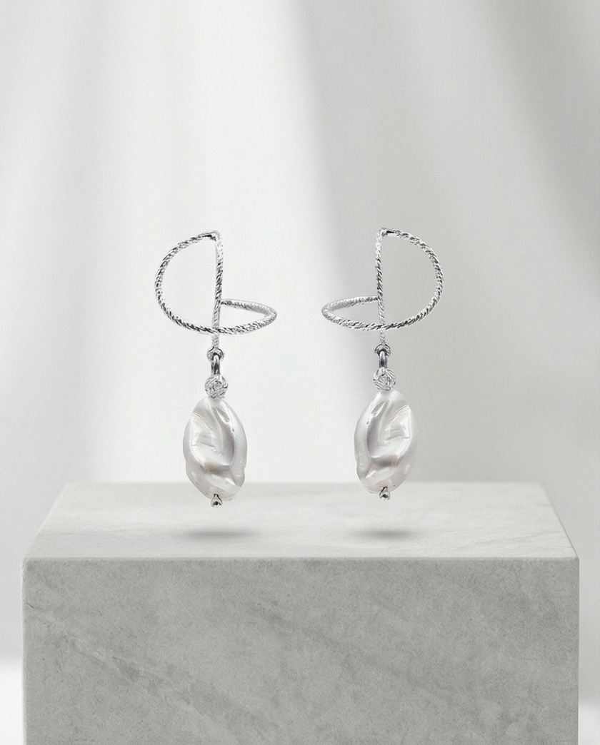Silver omega earrings with an artificial brook pearl