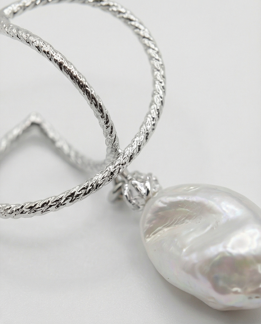Silver omega earrings with an artificial brook pearl