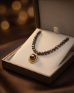 Pearl necklace in chocolate tones with pendant