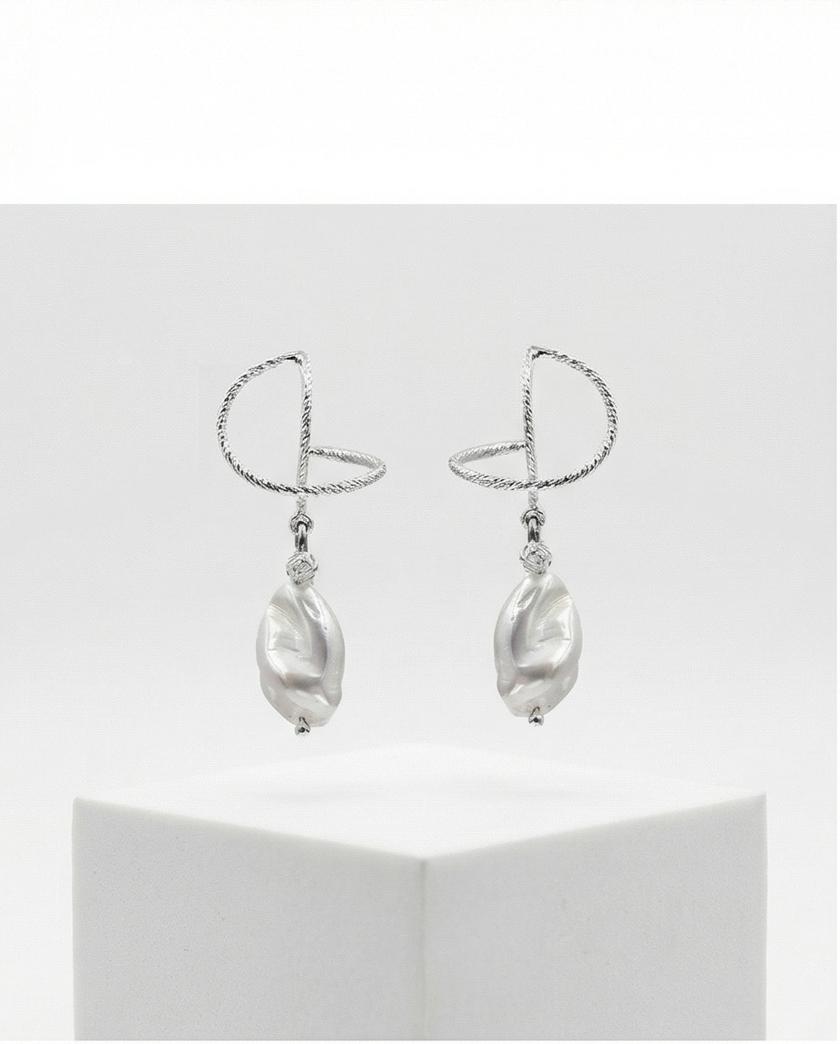 Silver omega earrings with an artificial brook pearl