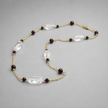 14 carat gold necklace with garnet and rock - crystal