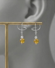Silver omega earrings with an artificial brook pearl