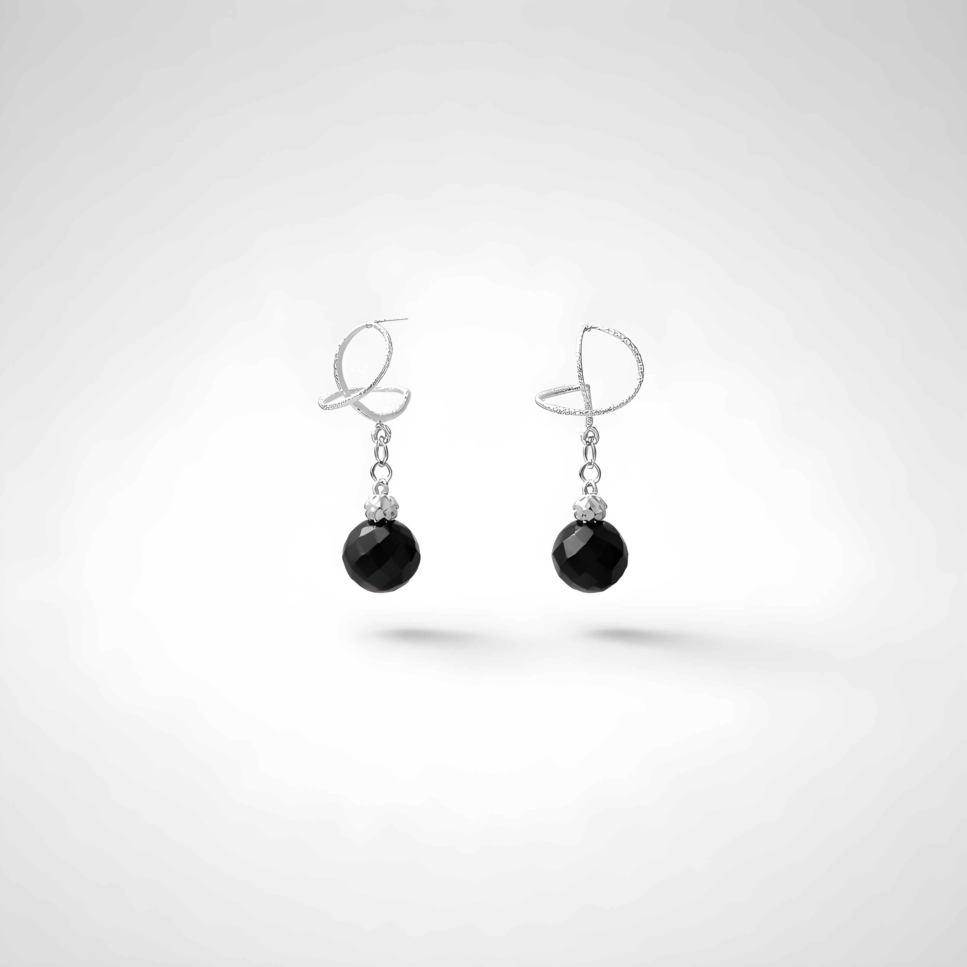 White gold omega earrings with onyx stone