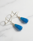 Silver earrings with a drop of blue agate