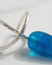 Silver earrings with a drop of blue agate