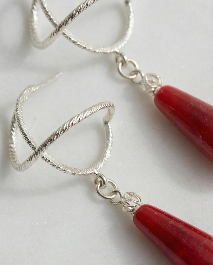 Silver earrings with a drop of red agate