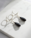 Silver earrings with a drop of brown agate