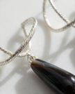 Silver earrings with a drop of brown agate