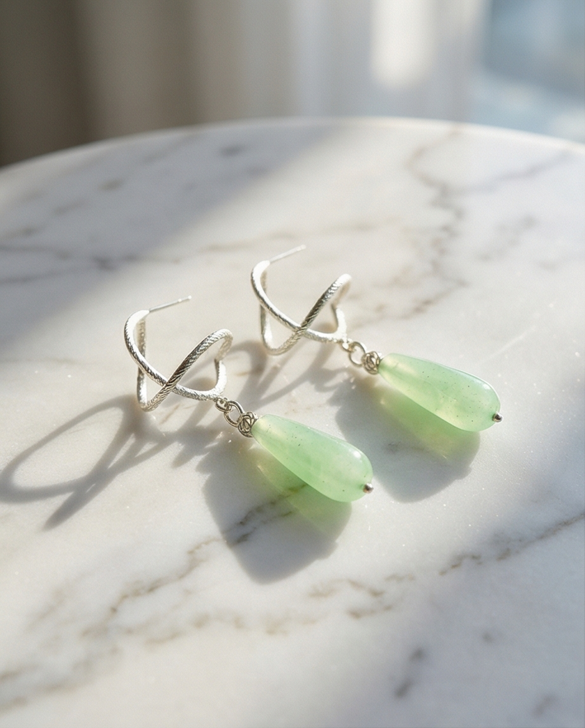 Silver earrings with a drop of agate in a still green shade