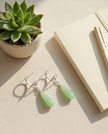 Silver earrings with a drop of agate in a still green shade