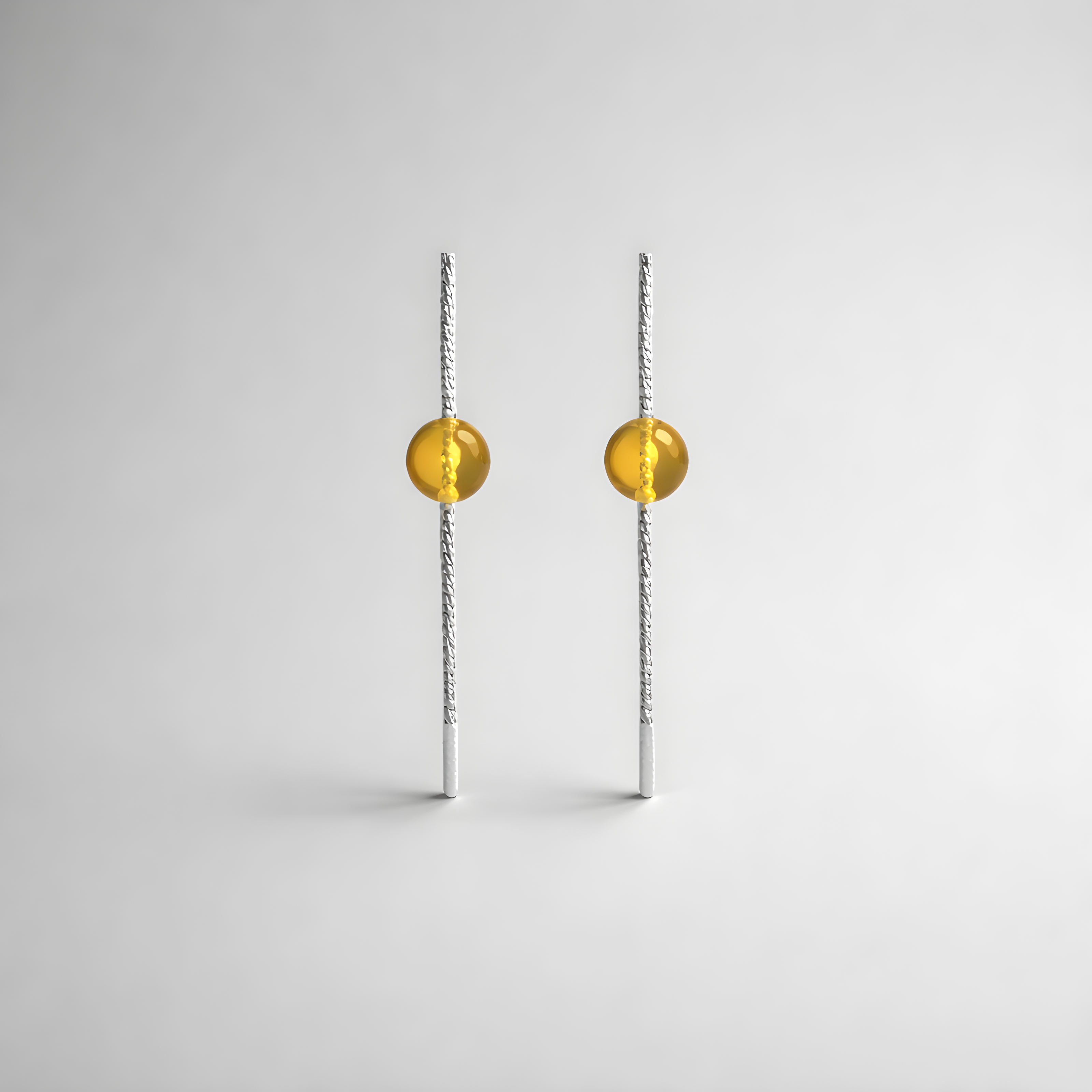 Earrings designed with amber