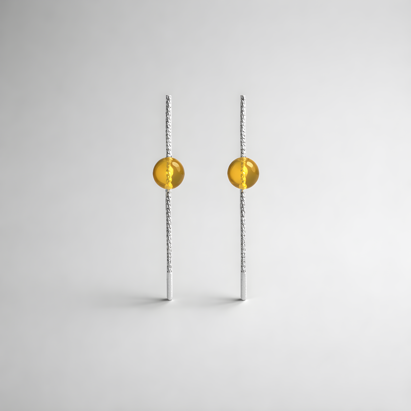 Earrings designed with amber