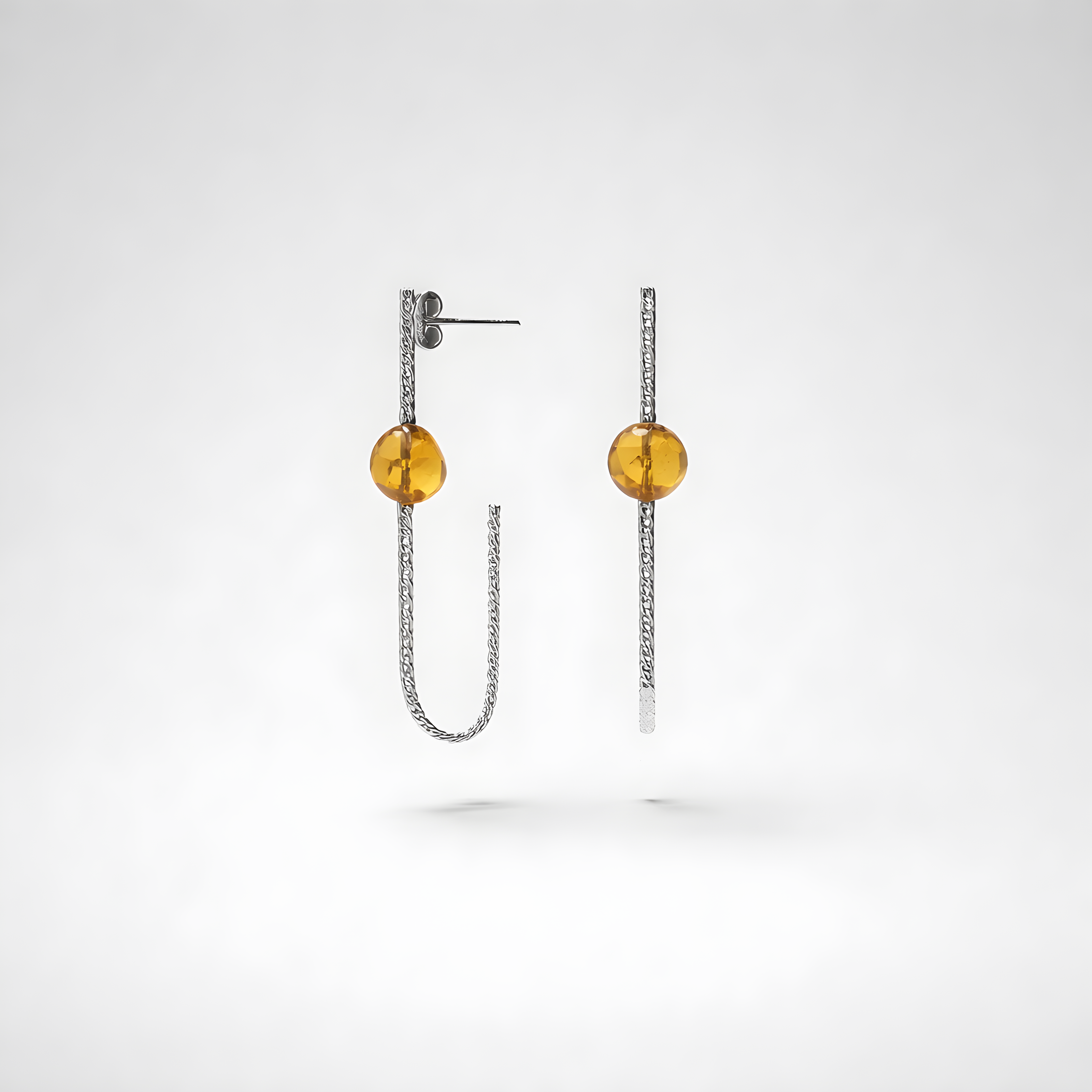 Earrings designed with amber