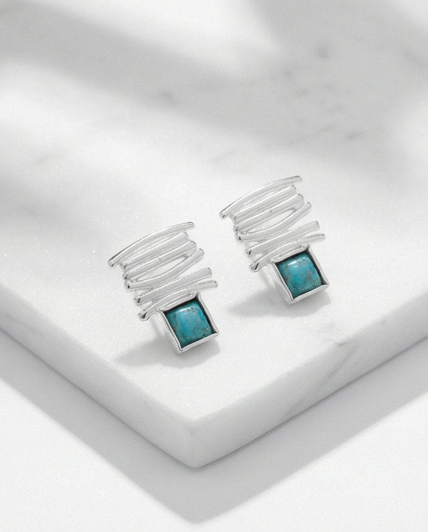 14 carat white gold earrings with a turquoise stone