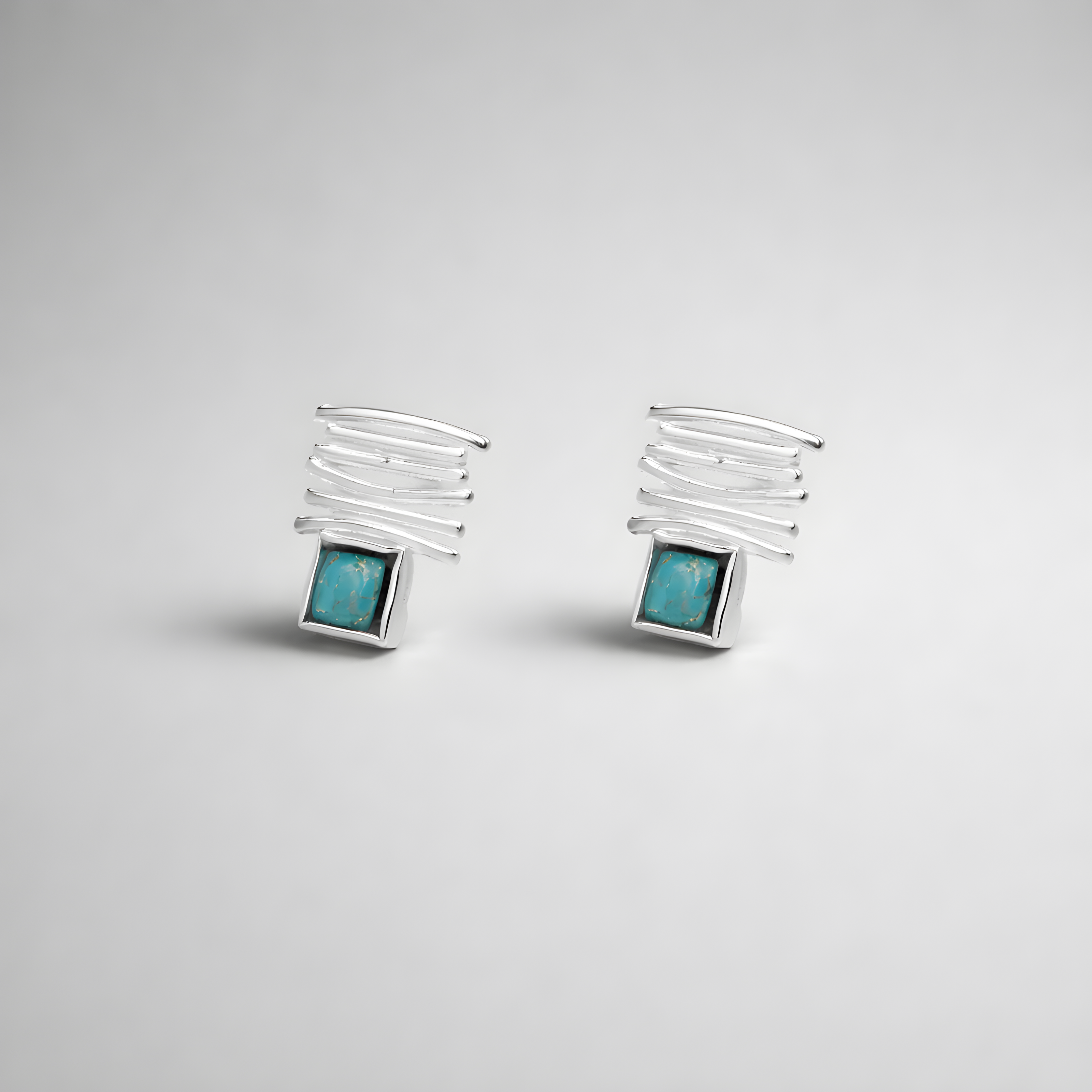 14 carat white gold earrings with a turquoise stone