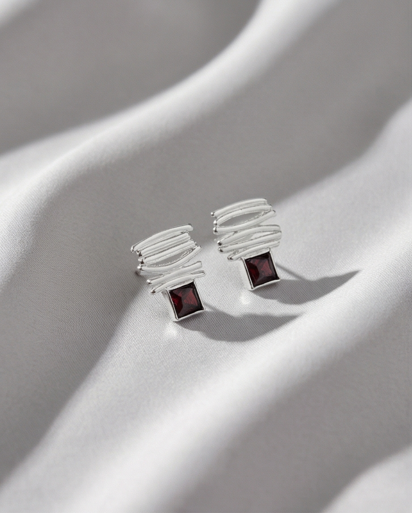 14 carat white gold earrings with garnet stones