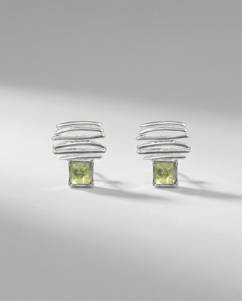 14 carat white gold earrings with chrysolite stones
