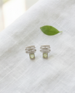 14 carat white gold earrings with chrysolite stones