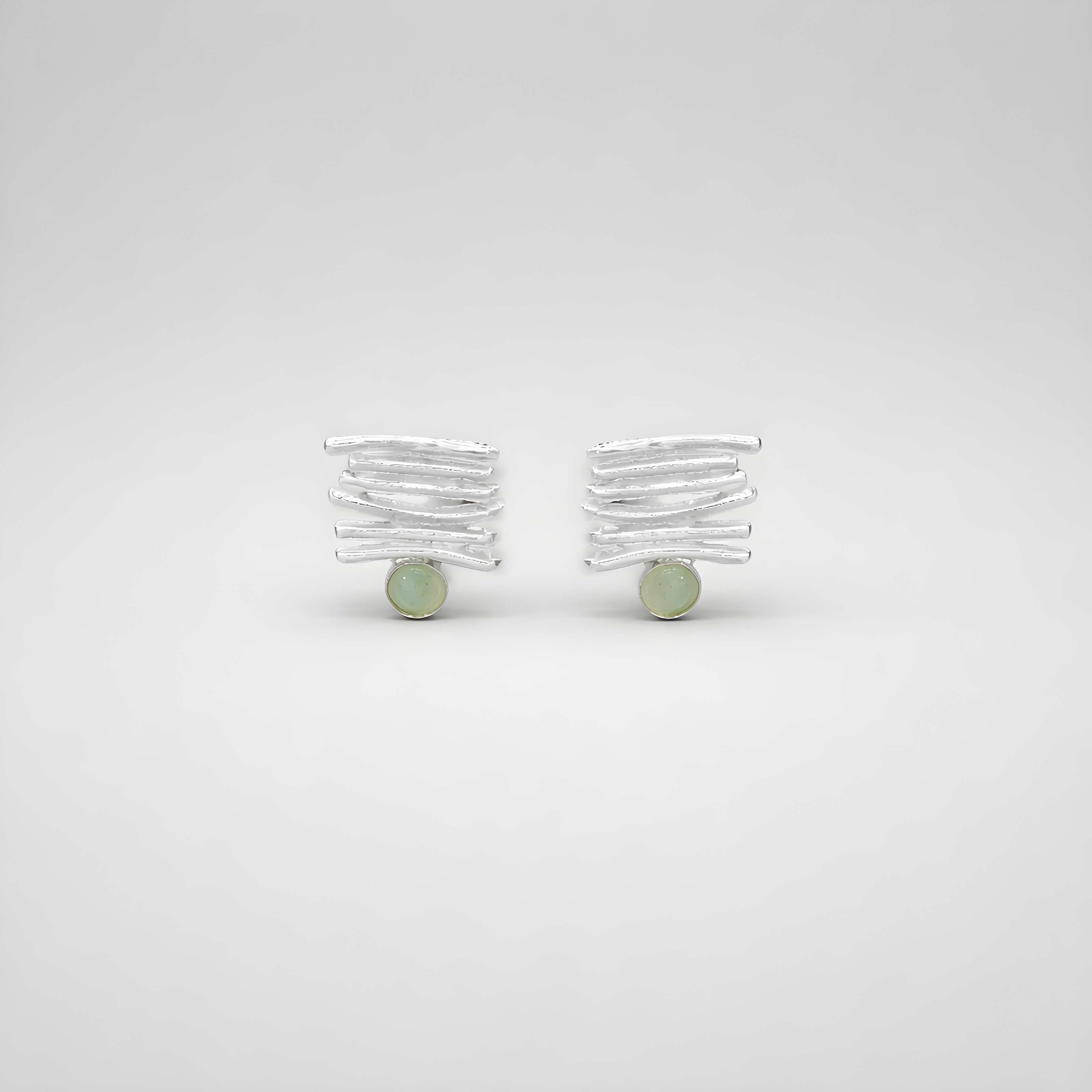 Silver earrings with parting stones