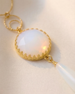 Silver necklace with pendant inlaid with white opalite