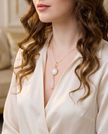 Silver necklace with pendant inlaid with white opalite