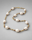 White pearl necklace and natural garnets