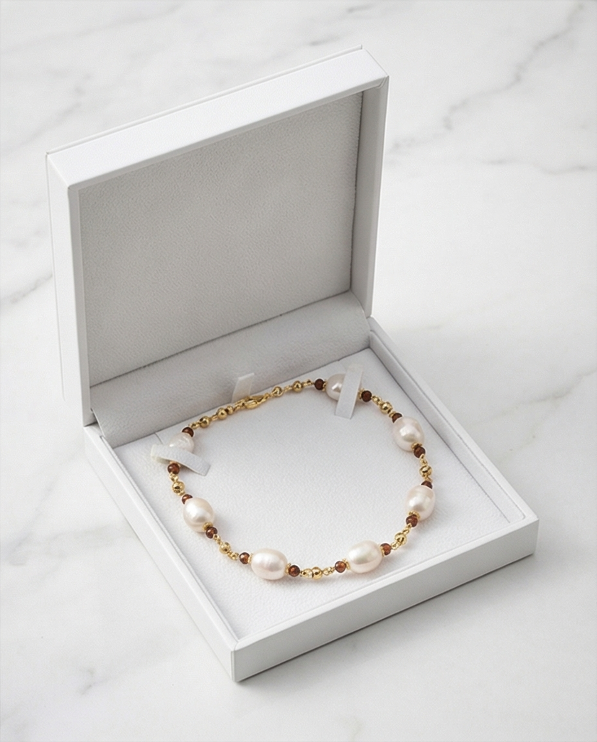 White pearl necklace and natural garnets