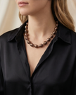 Pearl necklace in a drop of chocolate-toned rock