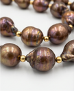 Pearl necklace in a drop of chocolate-toned rock