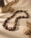 Pearl necklace in a drop of chocolate-toned rock