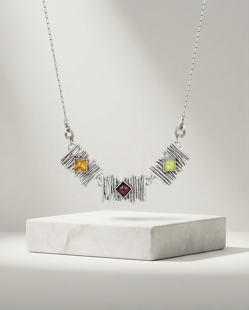 Silver pendant inlaid with citrine, olivine and garnet