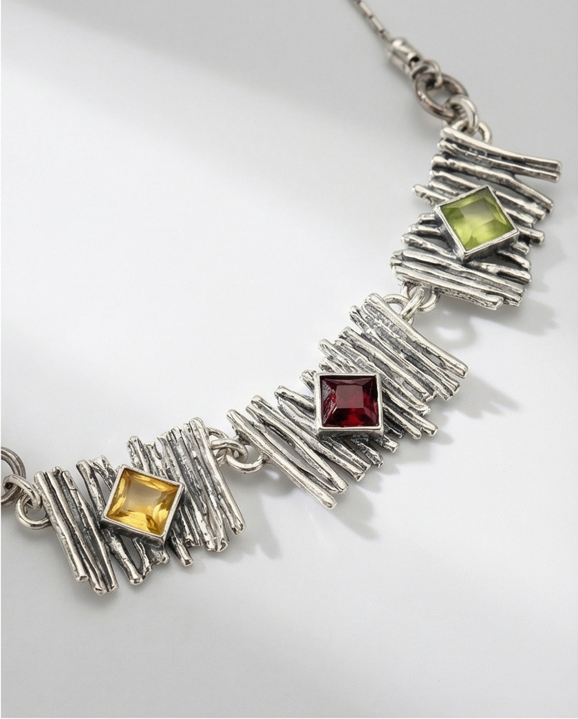 Silver pendant inlaid with citrine, olivine and garnet