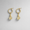 A set of 14 carat gold earrings with yellow opal and citrine charms