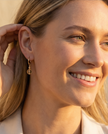 A set of 14 carat gold earrings with yellow opal and citrine charms
