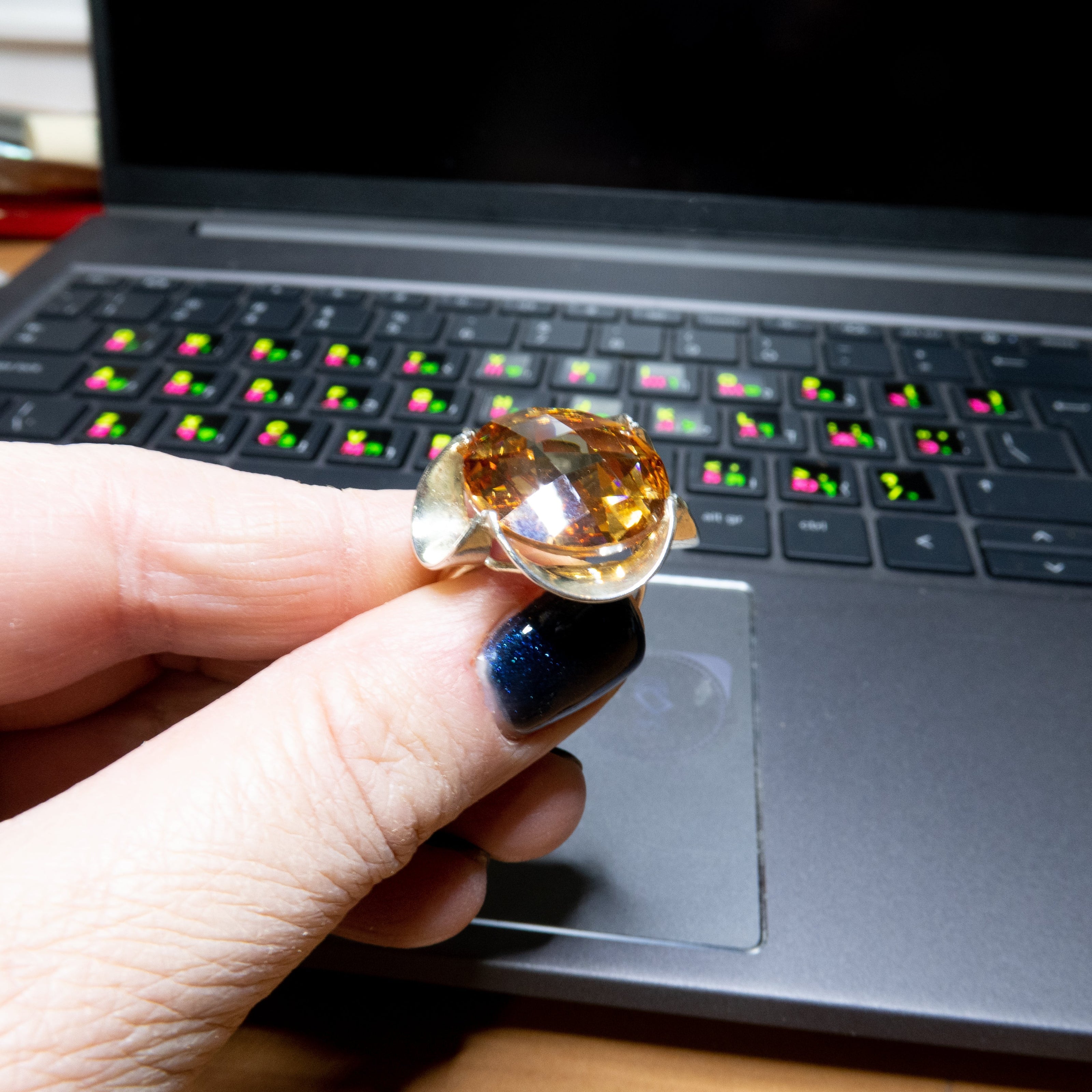 Silver ring with a crystal in the shade of citrine